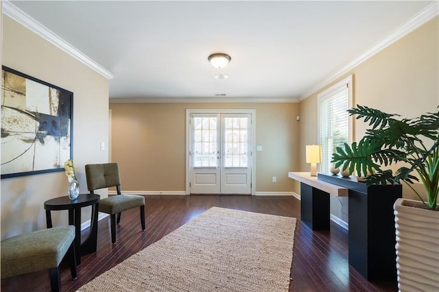 foyer entrance featuring dark wood-style floors, baseboards, ornamental molding, and french doors