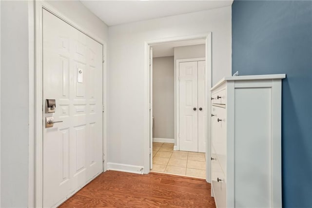 1101 Juniper St NE Unit 415, Atlanta, GA 30309 - hall with baseboards and light wood finished floors