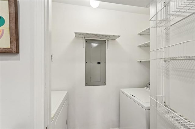 1101 Juniper St NE Unit 415, Atlanta, GA 30309 - clothes washing area with electric panel and separate washer and dryer