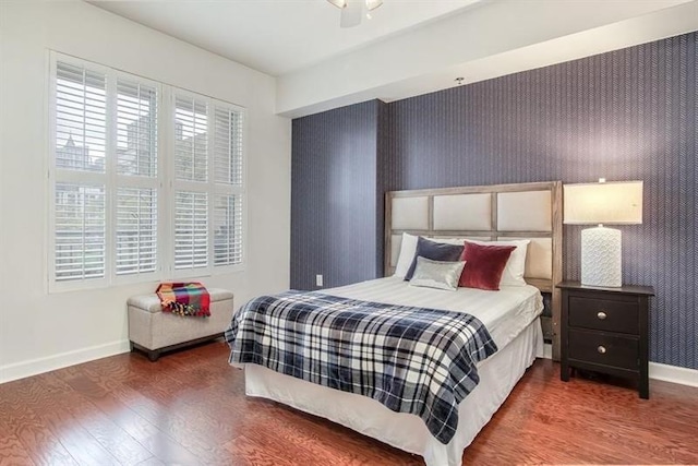 1101 Juniper St NE Unit 415, Atlanta, GA 30309 - bedroom featuring baseboards and wood finished floors