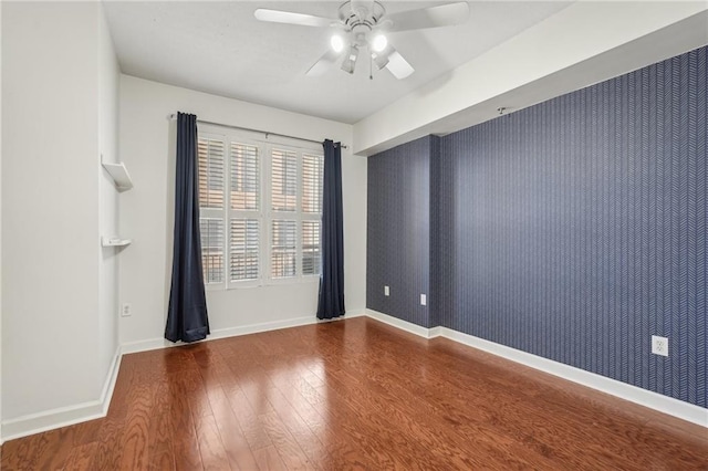 1101 Juniper St NE Unit 415, Atlanta, GA 30309 - unfurnished room with wood finished floors, a ceiling fan, and baseboards