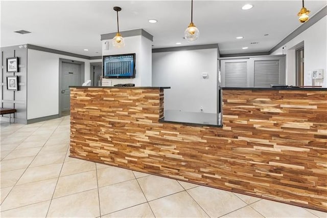 1101 Juniper St NE Unit 415, Atlanta, GA 30309 - kitchen with light tile patterned floors, recessed lighting, hanging light fixtures, and ornamental molding