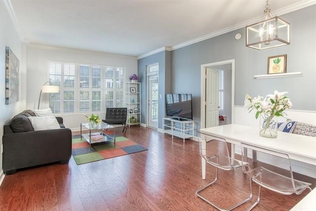 1101 Juniper St NE Unit 415, Atlanta, GA 30309 - living room featuring wood finished floors, crown molding, and a chandelier