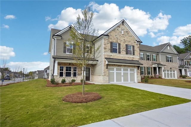 craftsman-style house featuring a front lawn and a garage