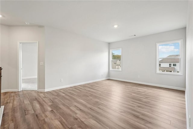 unfurnished room featuring light hardwood / wood-style flooring