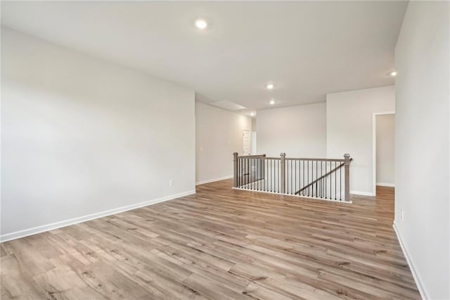 unfurnished room with light hardwood / wood-style flooring