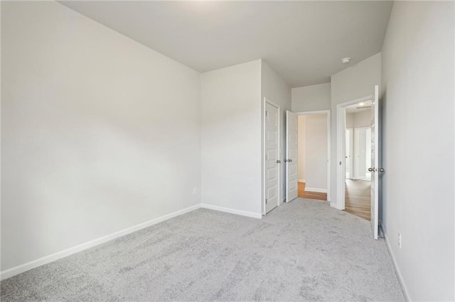 unfurnished bedroom with light carpet