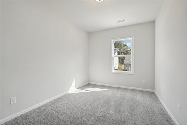 unfurnished room with carpet floors