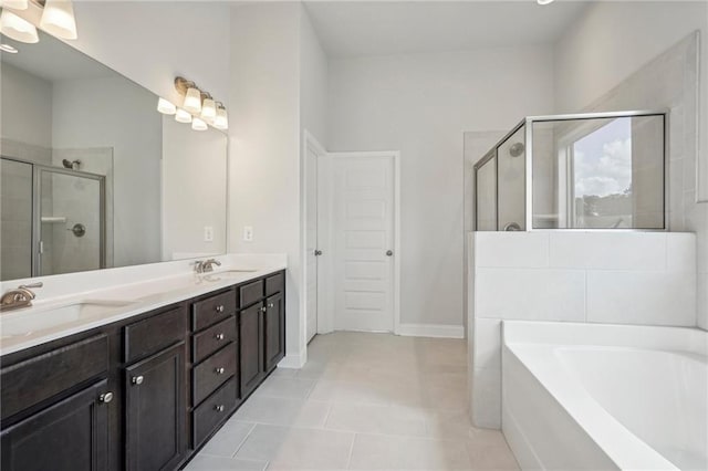 bathroom featuring vanity, separate shower and tub, and tile patterned floors