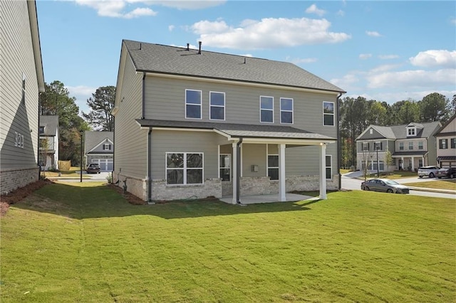 rear view of house with a lawn