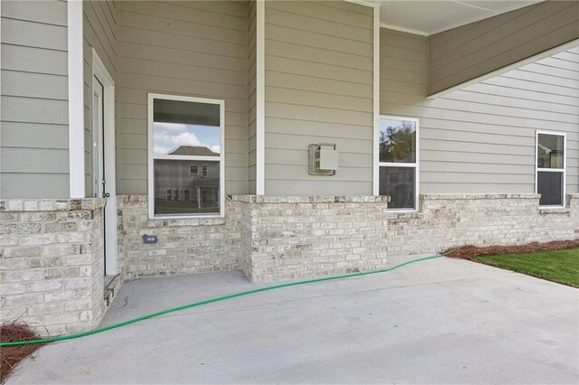 doorway to property with a patio area