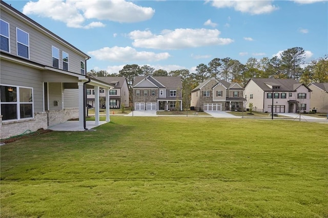 view of yard featuring a patio area and a garage