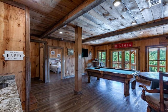 playroom featuring beam ceiling, wooden walls, french doors, and dark wood-type flooring