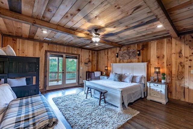 bedroom with beamed ceiling, dark hardwood / wood-style floors, wood walls, and wooden ceiling