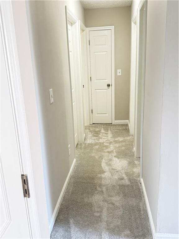 2115 Charter Ln, Lithonia, GA 30058 - hall featuring baseboards and carpet flooring