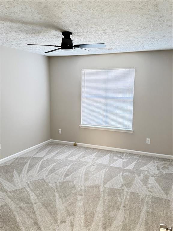 2115 Charter Ln, Lithonia, GA 30058 - carpeted empty room with baseboards, ceiling fan, and a textured ceiling