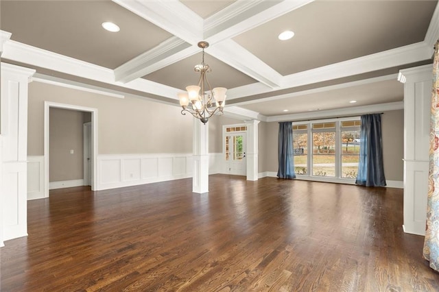 unfurnished living room with decorative columns, a chandelier, beamed ceiling, ornamental molding, and coffered ceiling