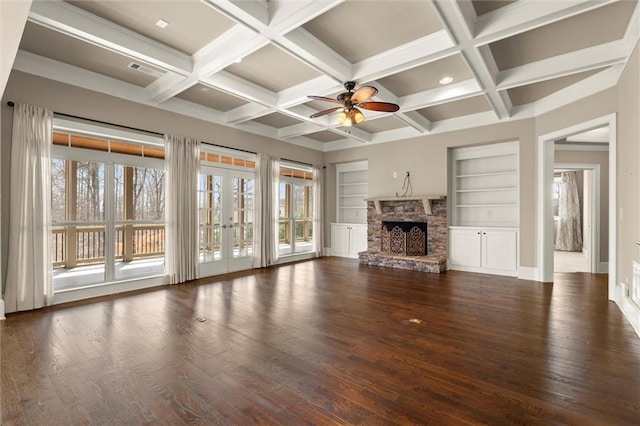 unfurnished living room with a ceiling fan, a fireplace, wood finished floors, beamed ceiling, and coffered ceiling
