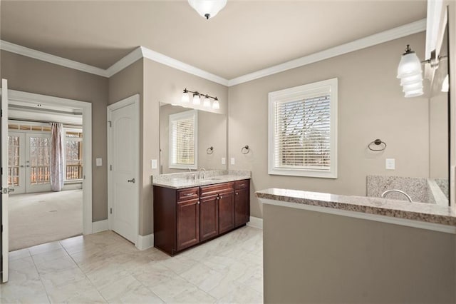 full bathroom featuring marble finish floors, baseboards, ornamental molding, and vanity