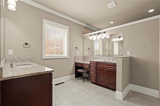 bathroom featuring ornamental molding, baseboards, two vanities, and recessed lighting