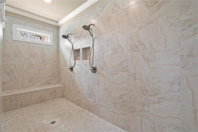 bathroom with crown molding and tiled shower