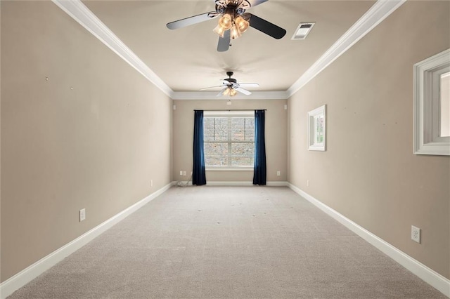 spare room with a ceiling fan, crown molding, baseboards, and light carpet