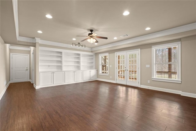 unfurnished living room with crown molding, a ceiling fan, a tray ceiling, baseboards, and recessed lighting