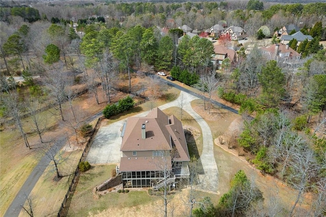 aerial view of property and surrounding area with nearby suburban area
