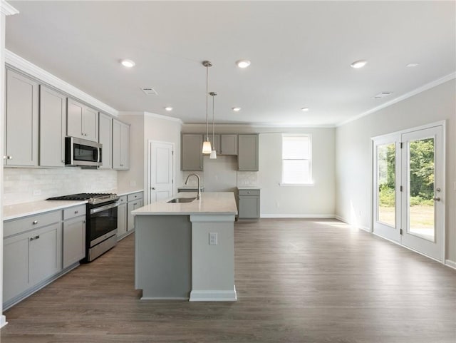 246 W Midland Ave, Winder, GA 30680 - kitchen featuring gray cabinetry, stainless steel appliances, a sink, crown molding, and tasteful backsplash