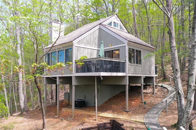 125 Wolfscratch Dr, Big Canoe, GA 30143 - back of property with a shingled roof, a wooden deck, and a chimney