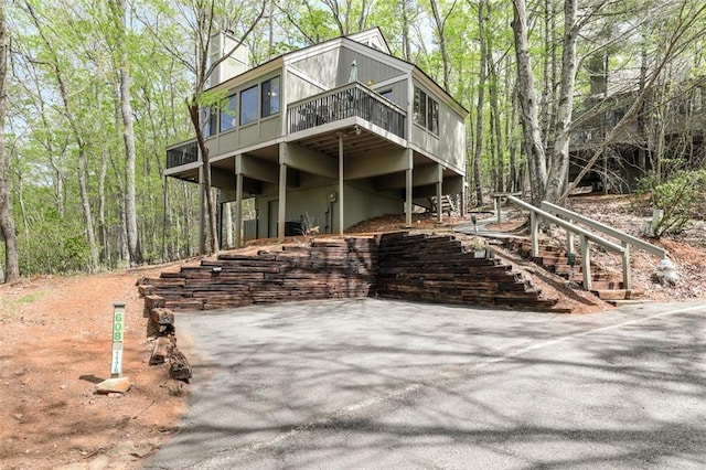 125 Wolfscratch Dr, Big Canoe, GA 30143 - view of front facade with a deck and stairs