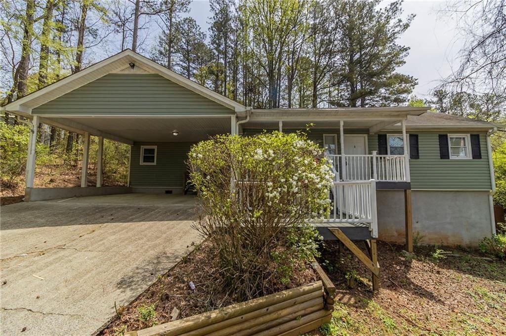 3821 Paul Samuel Rd NW, Kennesaw, GA 30152 - view of front of home featuring a porch, a carport, and driveway
