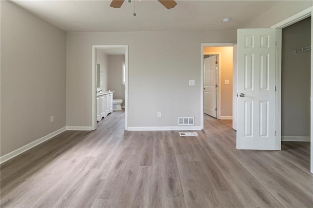 3821 Paul Samuel Rd NW, Kennesaw, GA 30152 - unfurnished bedroom with connected bathroom, a ceiling fan, visible vents, wood finished floors, and baseboards