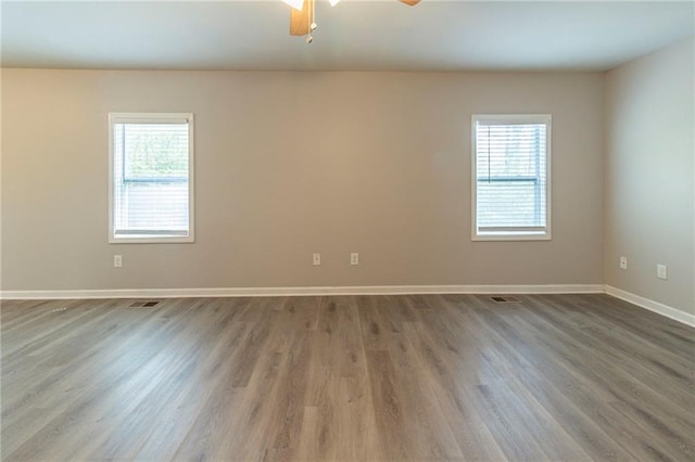 3821 Paul Samuel Rd NW, Kennesaw, GA 30152 - unfurnished room featuring visible vents, baseboards, ceiling fan, and wood finished floors