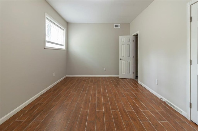 3821 Paul Samuel Rd NW, Kennesaw, GA 30152 - spare room featuring dark wood-type flooring, visible vents, and baseboards
