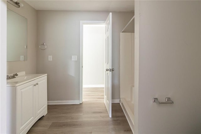 3821 Paul Samuel Rd NW, Kennesaw, GA 30152 - bathroom with wood finished floors, vanity, and baseboards