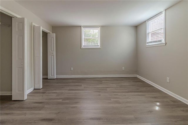 3821 Paul Samuel Rd NW, Kennesaw, GA 30152 - unfurnished bedroom with a closet, baseboards, and wood finished floors