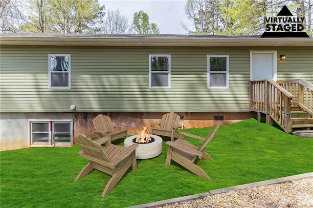 3821 Paul Samuel Rd NW, Kennesaw, GA 30152 - back of property featuring an outdoor fire pit and a lawn