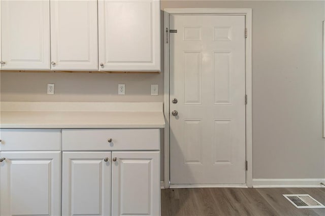 3821 Paul Samuel Rd NW, Kennesaw, GA 30152 - laundry area featuring baseboards, dark wood-style floors, and visible vents