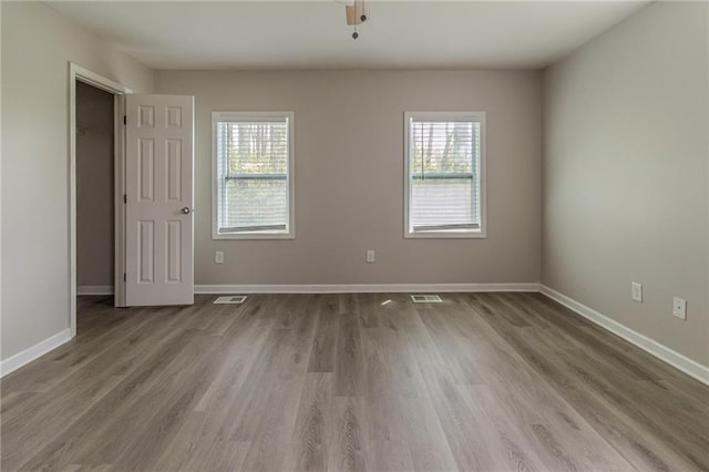 3821 Paul Samuel Rd NW, Kennesaw, GA 30152 - unfurnished room with visible vents, baseboards, and wood finished floors