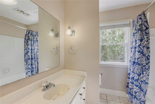 3707 Dunwoody Club Dr, Atlanta, GA 30350 - full bath featuring vanity, tile patterned floors, baseboards, and shower / bath combo with shower curtain