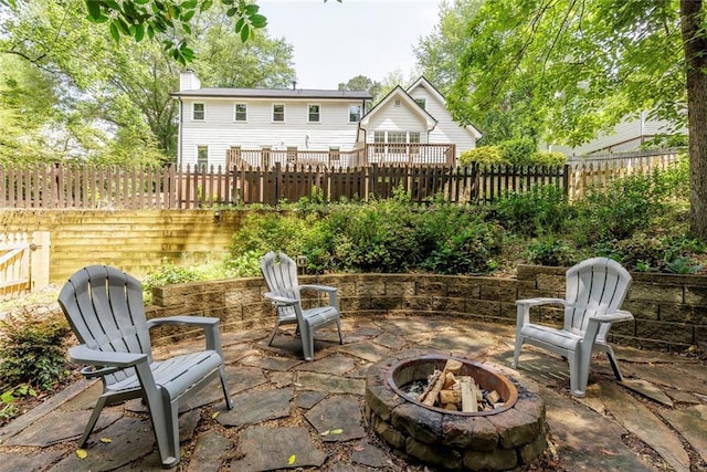3707 Dunwoody Club Dr, Atlanta, GA 30350 - fenced backyard with a fire pit and a patio area