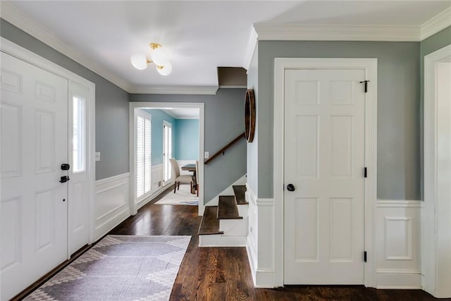 3707 Dunwoody Club Dr, Atlanta, GA 30350 - entrance foyer featuring crown molding, stairway, wainscoting, dark wood finished floors, and a decorative wall