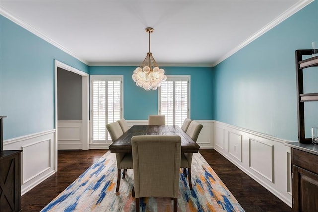 3707 Dunwoody Club Dr, Atlanta, GA 30350 - dining area featuring plenty of natural light, dark wood finished floors, a chandelier, a wainscoted wall, and crown molding