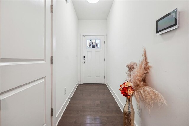 entryway with dark hardwood / wood-style floors