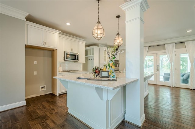 875 Soaring Cir, Marietta, GA 30062 - kitchen with appliances with stainless steel finishes, dark wood-type flooring, white cabinets, recessed lighting, and french doors