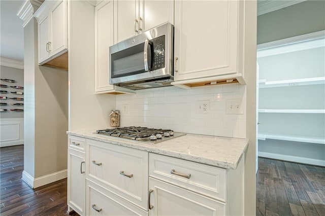 875 Soaring Cir, Marietta, GA 30062 - kitchen with appliances with stainless steel finishes, dark wood finished floors, ornamental molding, decorative backsplash, and white cabinetry