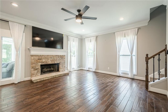 875 Soaring Cir, Marietta, GA 30062 - unfurnished living room with healthy amount of natural light, stairs, a ceiling fan, ornamental molding, and dark wood-type flooring