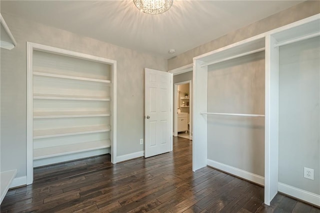 875 Soaring Cir, Marietta, GA 30062 - unfurnished bedroom with dark wood finished floors and a chandelier