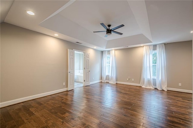 875 Soaring Cir, Marietta, GA 30062 - empty room with a tray ceiling, ceiling fan, and dark wood-style floors